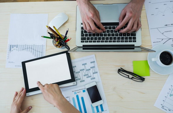 Laptop showing SEO tools dashboard for keyword research, backlinks and website ranking analysis